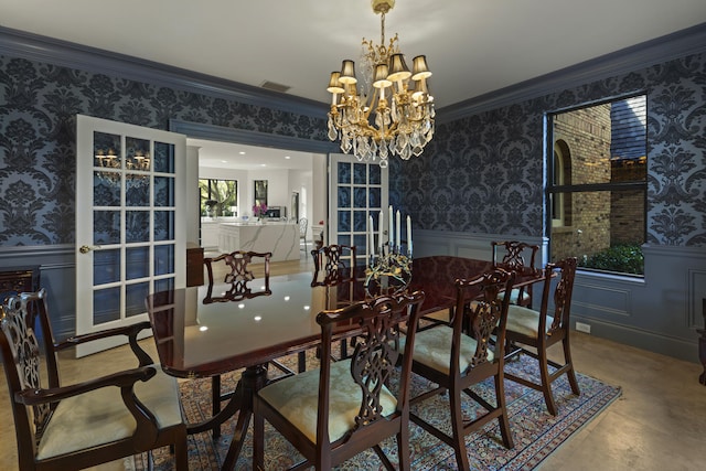 dining area with wallpapered walls, crown molding, and wainscoting