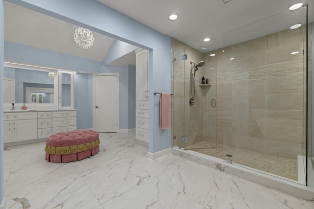 bathroom featuring marble finish floor, recessed lighting, a shower stall, baseboards, and vanity