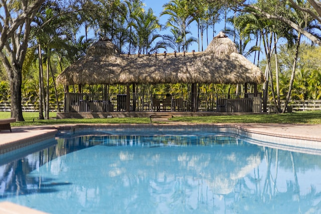 view of pool featuring a gazebo, a fenced in pool, and fence