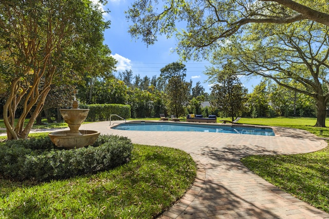 outdoor pool with a lawn