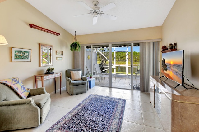 tiled living room with lofted ceiling and ceiling fan