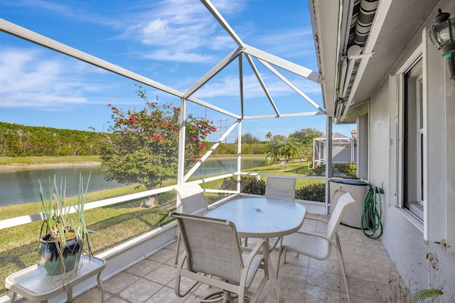 sunroom / solarium with a wealth of natural light and a water view