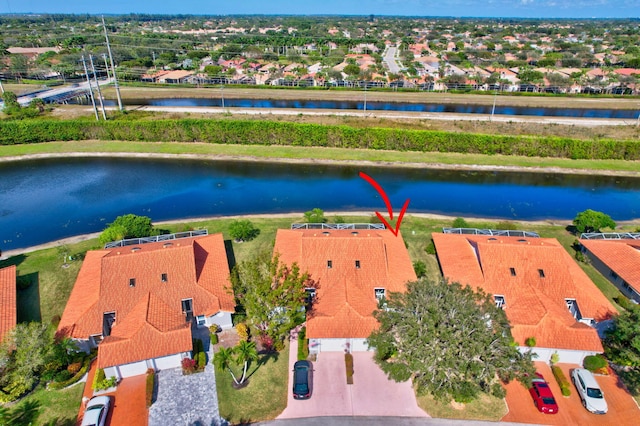 birds eye view of property featuring a water view