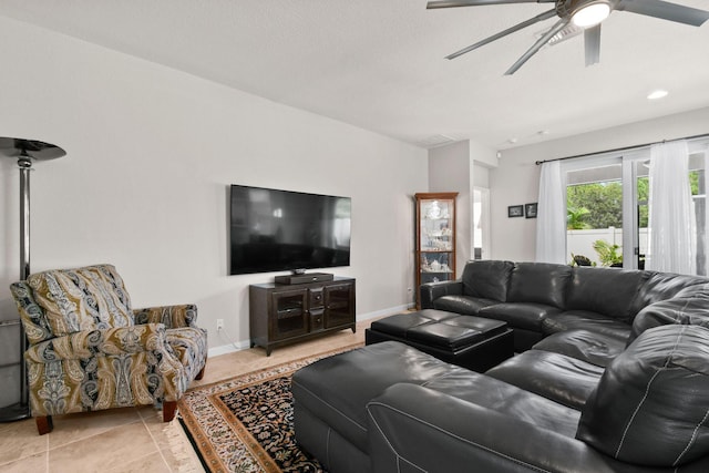 tiled living room with ceiling fan