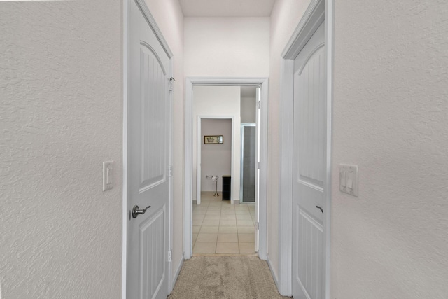 hallway with light tile patterned floors