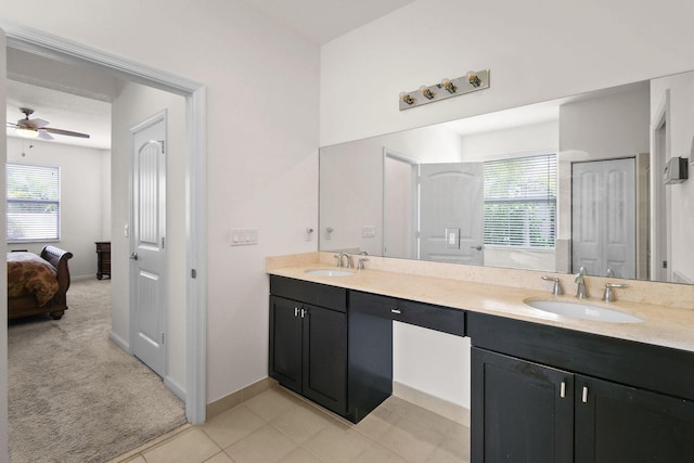 bathroom with ceiling fan, vanity, tile patterned flooring, and a wealth of natural light