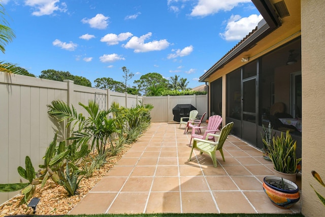 view of patio with a sunroom