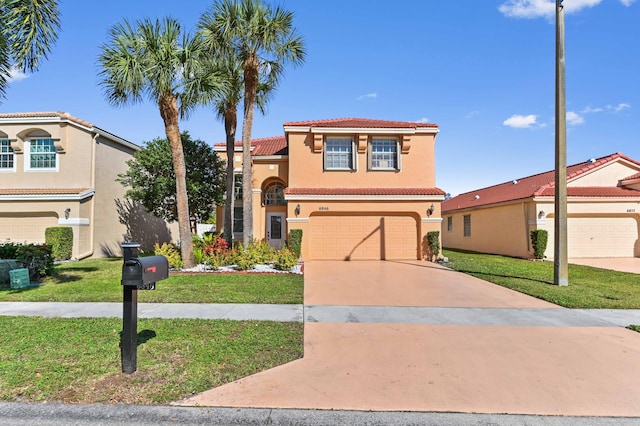 mediterranean / spanish-style house with a tile roof, stucco siding, concrete driveway, an attached garage, and a front lawn