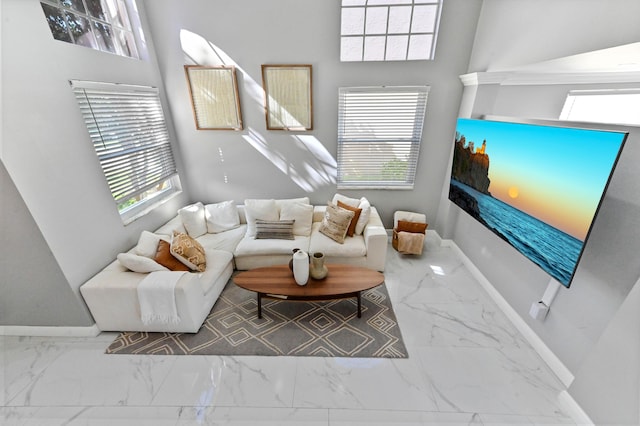 living area with marble finish floor and baseboards