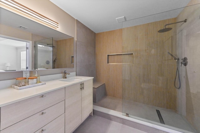 full bath with visible vents, a walk in shower, and vanity