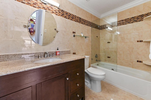 full bathroom with  shower combination, tile patterned flooring, crown molding, vanity, and tile walls