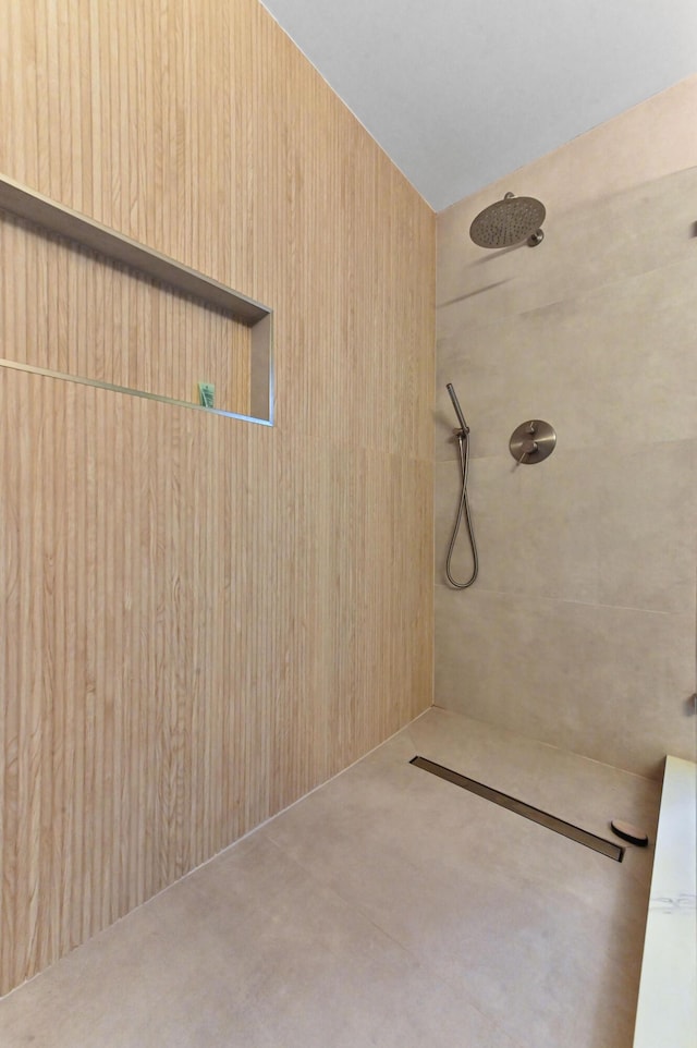 bathroom with a tile shower