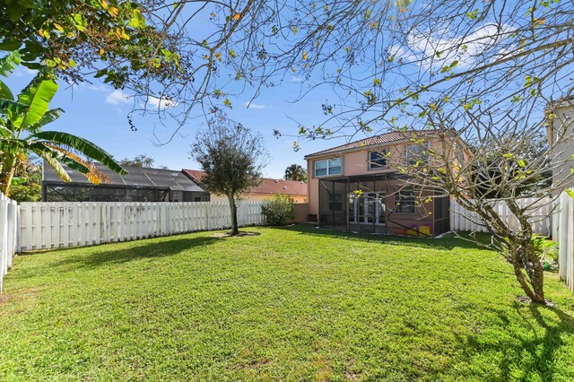 rear view of house with a yard