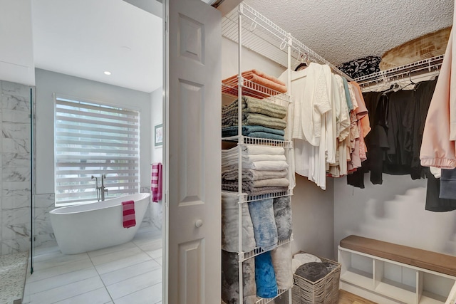 walk in closet featuring tile patterned floors