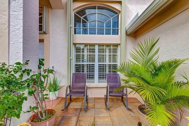 doorway to property with a patio area