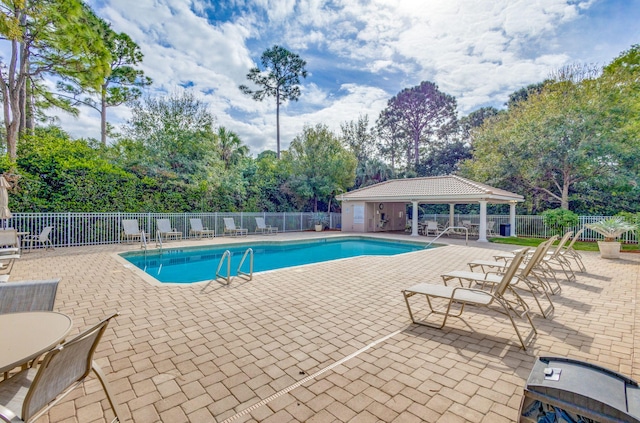 view of swimming pool with a patio