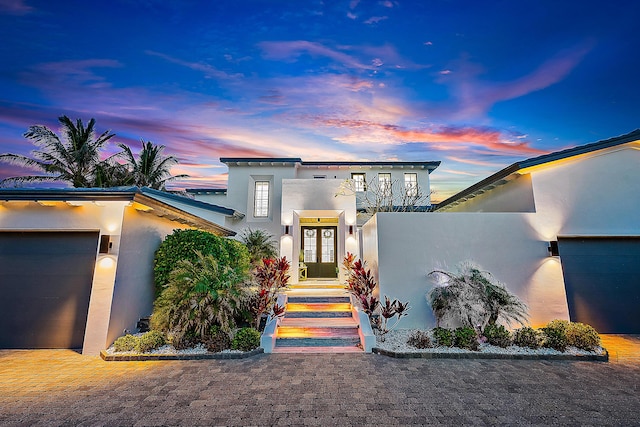 view of front of property with a garage