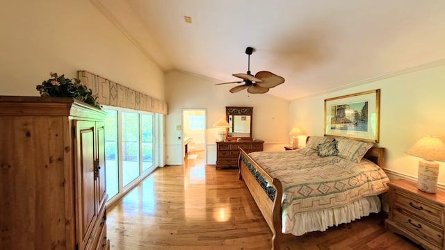 bedroom featuring vaulted ceiling, ornamental molding, ceiling fan, access to exterior, and hardwood / wood-style floors