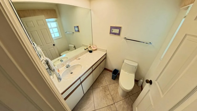 bathroom with vanity, tile patterned floors, and toilet