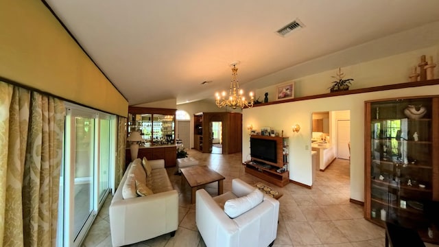 living room with lofted ceiling, light tile patterned floors, and a chandelier