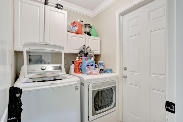 laundry area with cabinets, ornamental molding, and independent washer and dryer