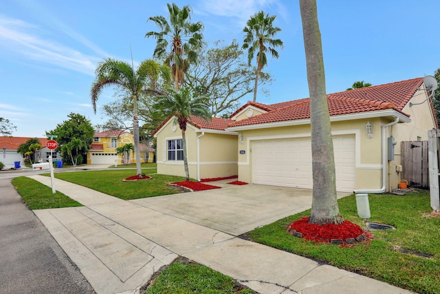 mediterranean / spanish-style home with a front yard