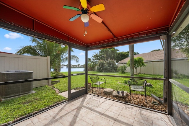 sunroom / solarium featuring ceiling fan