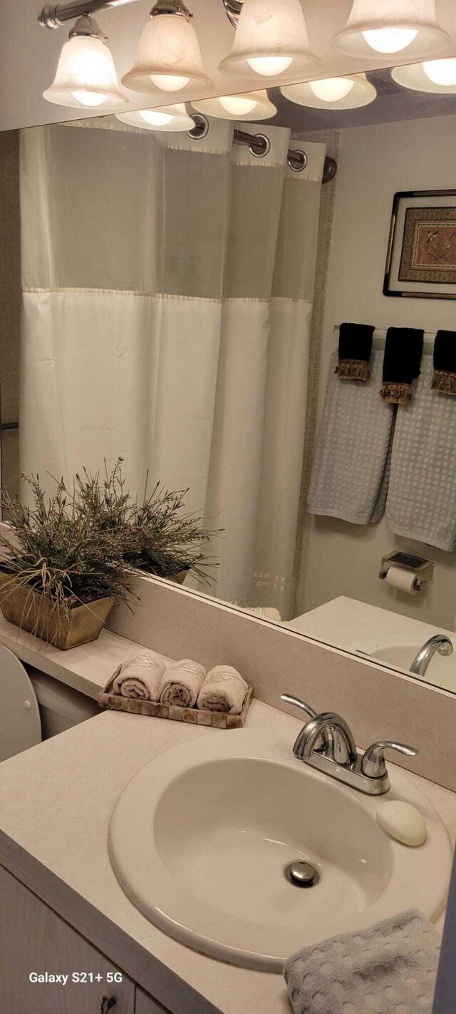 bathroom with sink and walk in shower