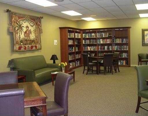 sitting room with carpet and a paneled ceiling