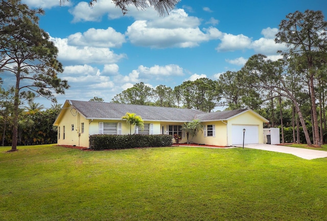 ranch-style house featuring a garage and a front yard