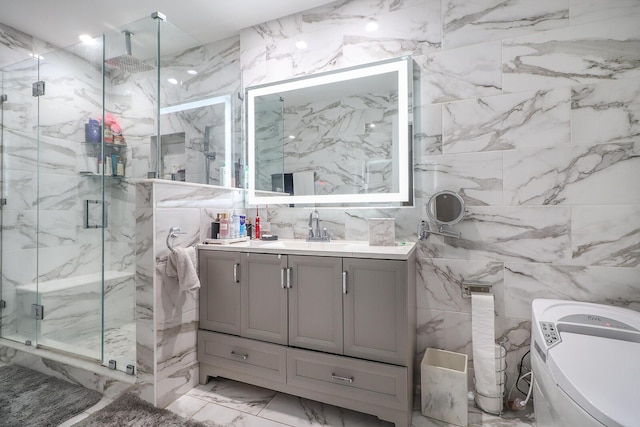 bathroom with a shower with door and vanity