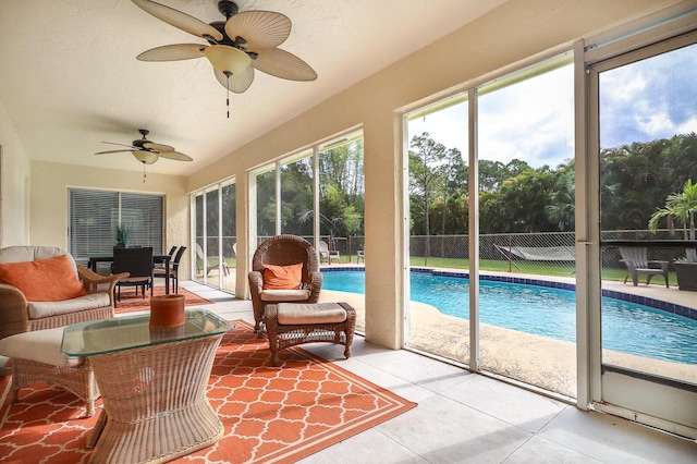 sunroom / solarium with ceiling fan