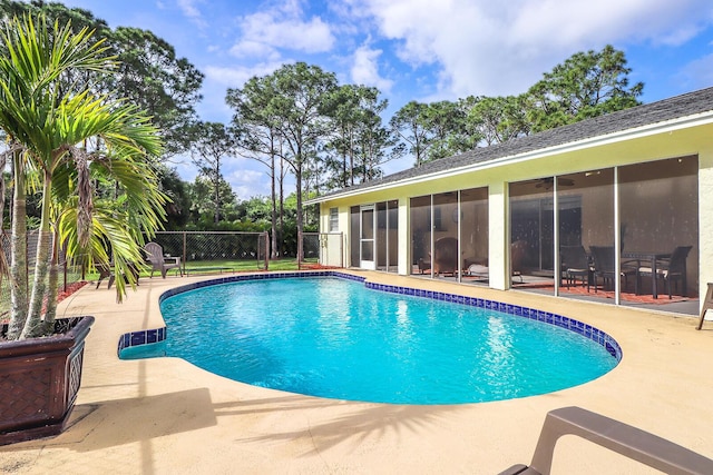 view of pool featuring a sunroom and a patio area