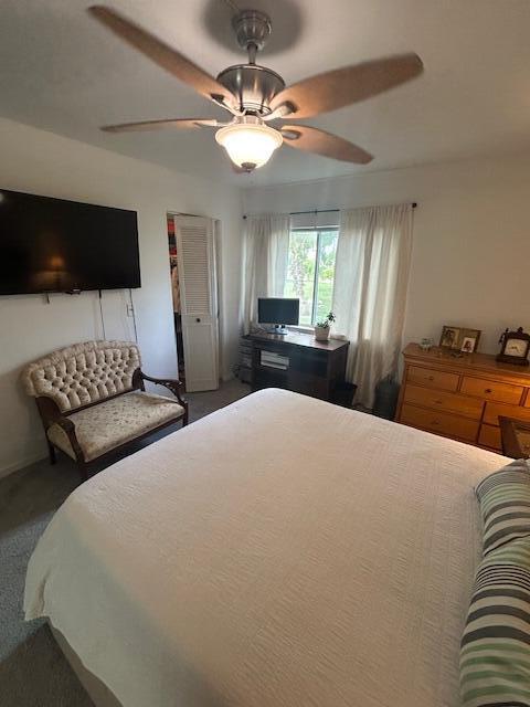 bedroom featuring carpet floors and ceiling fan