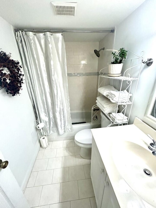 full bathroom featuring shower / bath combination with curtain, tile patterned floors, vanity, and toilet