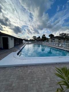 view of swimming pool with a patio area