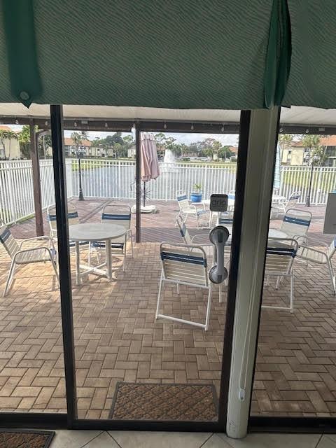 view of patio with a water view