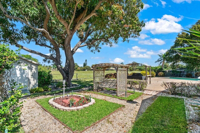 view of yard with fence, an outdoor pool, a pergola, an outdoor structure, and a patio area