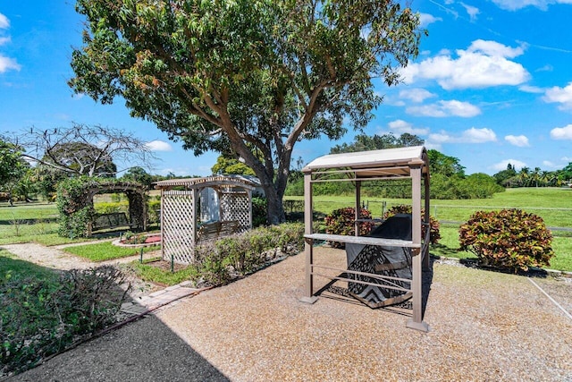 view of patio / terrace featuring a gazebo and fence