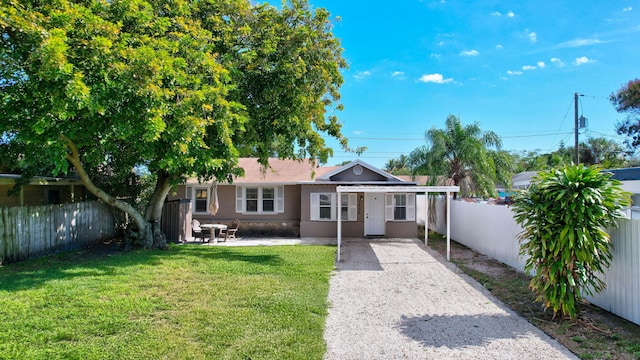 ranch-style home with a patio area and a front lawn