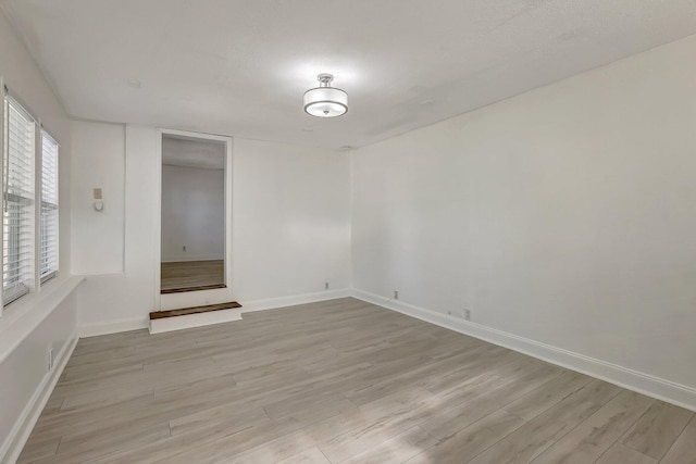 unfurnished room featuring light hardwood / wood-style floors