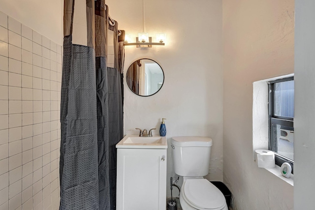 bathroom with vanity, toilet, and a shower with curtain