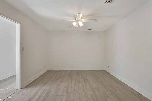 unfurnished room with ceiling fan and light hardwood / wood-style flooring