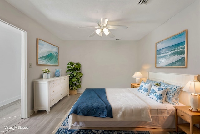 bedroom featuring ceiling fan and light hardwood / wood-style floors