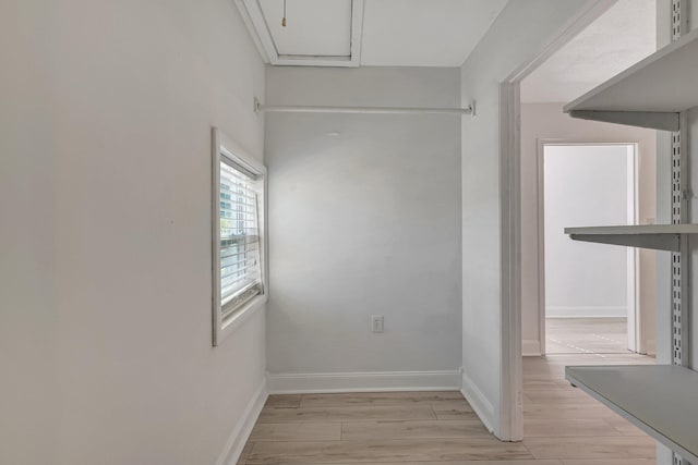 unfurnished room with light wood-type flooring