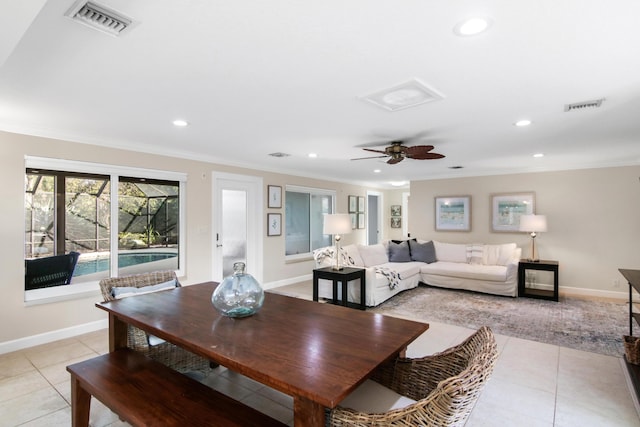 dining room featuring light tile patterned flooring, ceiling fan, and crown molding