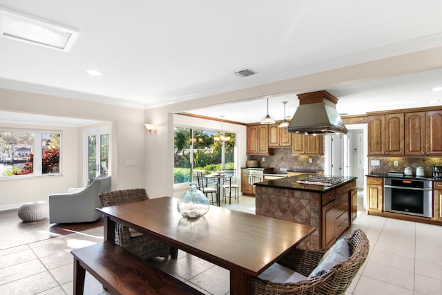 tiled dining area with crown molding