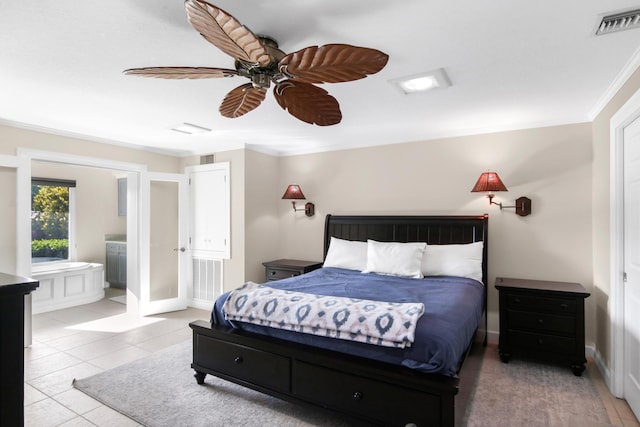 tiled bedroom featuring ceiling fan, ornamental molding, and ensuite bathroom