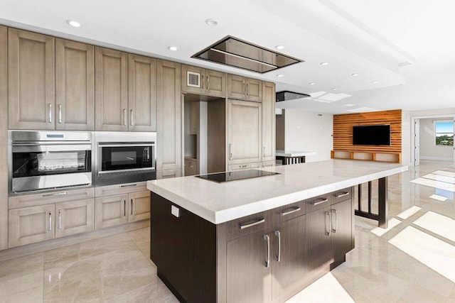 kitchen with visible vents, a kitchen island, appliances with stainless steel finishes, marble finish floor, and recessed lighting