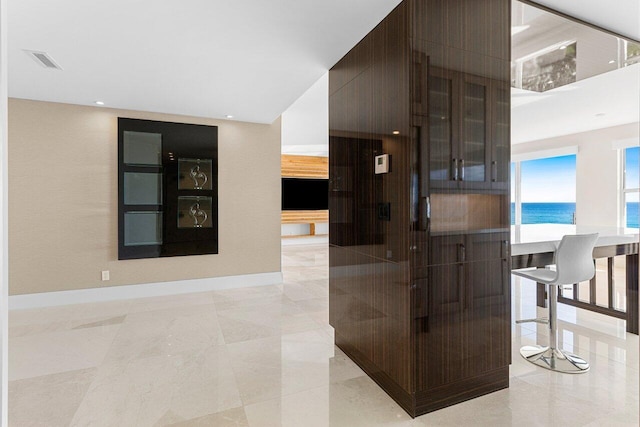 interior space featuring baseboards, visible vents, and recessed lighting